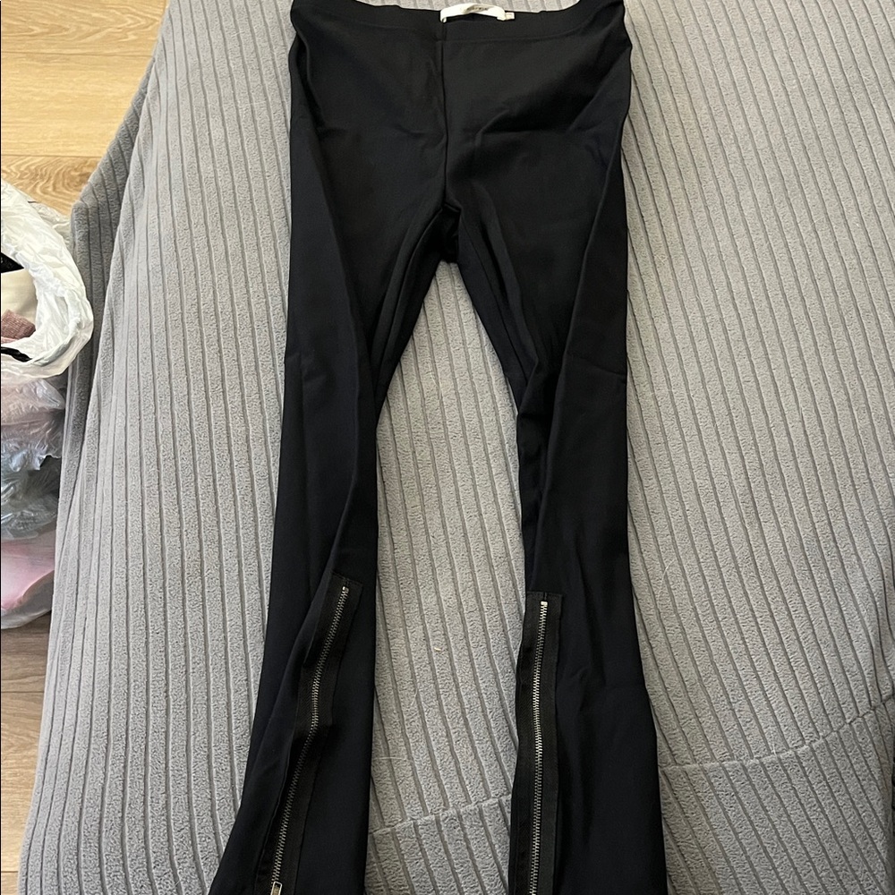 Elaine Kim Black Women's Pants with Zipper Detail. 94%nylon 6%elastine